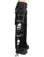 Side view of women black skull gothic wide leg pants with chains